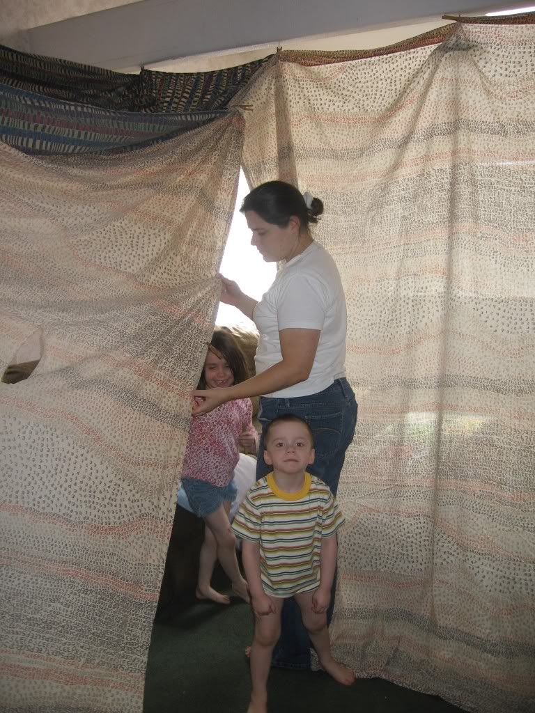 Aunt Hila building the tent